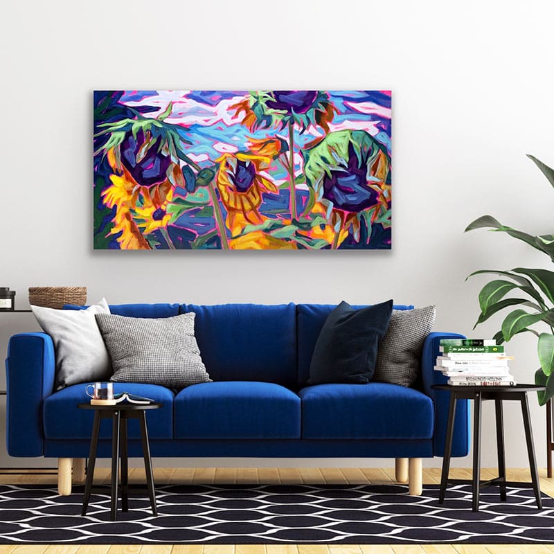 Sunflower painting over blue sofa couch